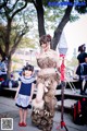 A woman and a little girl dressed up in costumes.